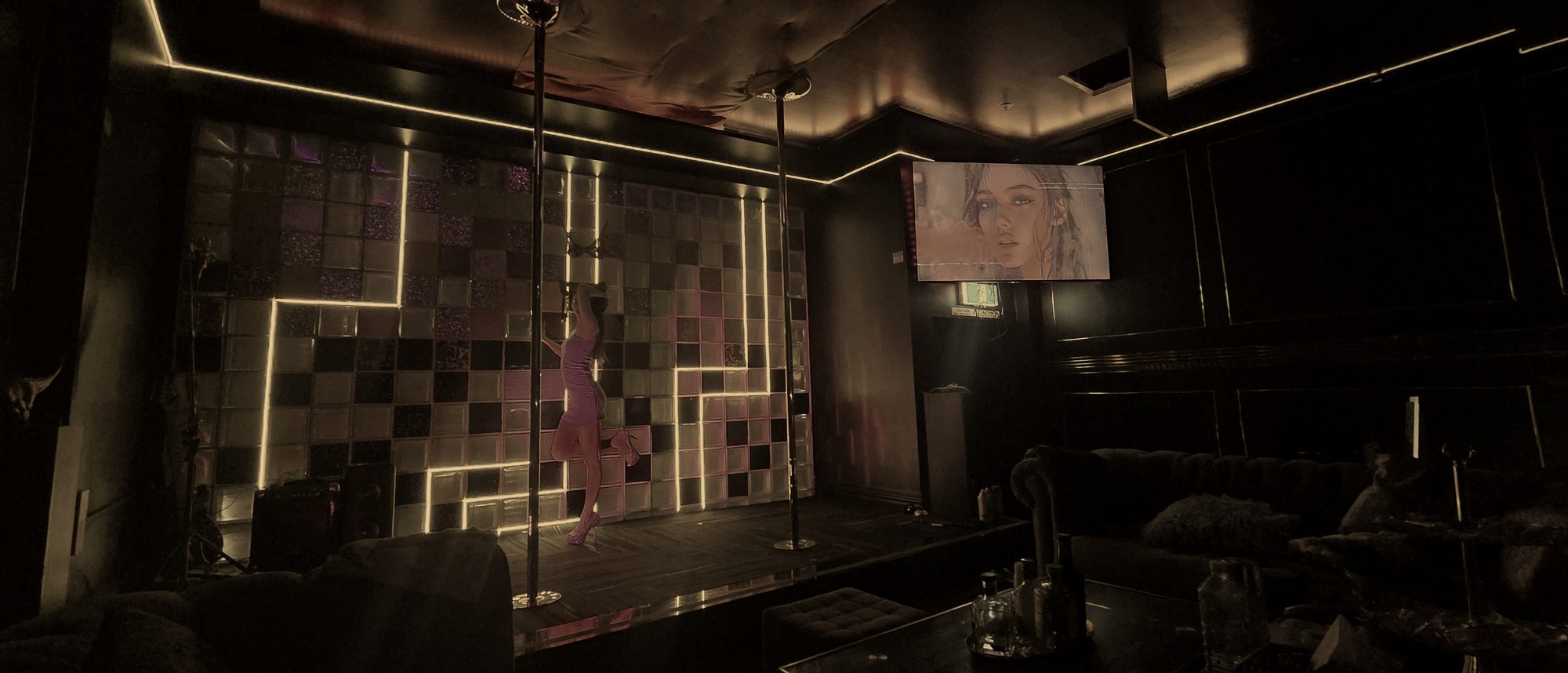 The stage at The Black Garter, warm light on dark timber